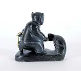 Philiposie Napatuk, Untitled - Pulling a Seal from Blowhole, 1962, black stone carving with leather