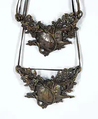 Two Botanical Face Necklaces by Dora de Pedery-Hunt, 1974, bronze with leather necklace, sold Sep 2018