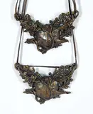 Dora de Pedery-Hunt, Two Botanical Face Necklaces, 1974, bronze with leather necklace