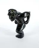 Kelly Etidlouie, Untitled - Crouching Merman, 1995, black stone carving