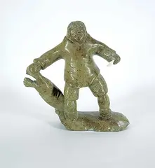 Davidee Kakasilk, Hunter and Seal, 1999, mottled green stone and bone carving