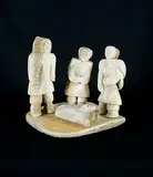 Elisapee Kuniliusee, Two Women, Man and Seal, bone carving