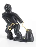 Thomassie Tukai, Untitled - Hunter and Seal, black stone carving with bone and leather
