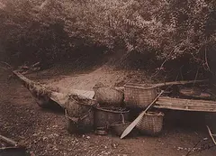 Edward S. Curtis, Untitled - Dugout Canoe with Baskets and Paddle, photograph on paper