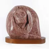 Lorne Fineday, Untitled - In Beautiful Arms, mottled red stone sculpture