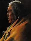 Harry Pollard, Spring Chief [Blackfoot Indian], hand coloured photograph on paper