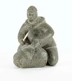Charlie Kalingoapik Angutigirk, Untitled - Hunter and Seal, light green stone carving with bone
