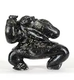 Uriash Puqiqnak, Inuk, 1999, black stone carving with bone