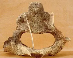 Hunter by Sakey Evvik, 1989, carving in bone, sold Apr 1996