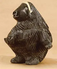 Musk Ox by Judas Ullulaq, carving in green stone, sold Apr 1996