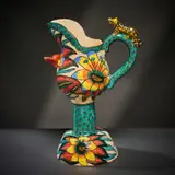 Stemmed milk jug with animal and flowers by Ardmore Ceramic Studio, 2002, painted and glazed ceramic, offered Jun 2026