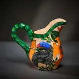 Ardmore Ceramic Studio, Guineafowl and flower milk jug, 2003, painted and glazed ceramic