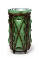 Green glass vase moulded into wrought iron frame by Louis Majorelle, glass and wrought iron, sold May 2026