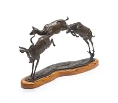 Arend Eloff, Leaping Kudus, bronze with a brown patina, on a wooden base