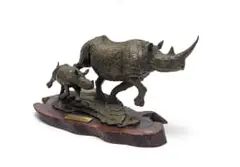 Rhino Mother and Calf by Keith Calder, 1989, bronze with a brown patina, on a wooden base, sold May 2026