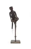 Tsonga-Shangaan Unrecorded artist, Early Stopper, The Strongman, carved wood, textile and beads on a steel base