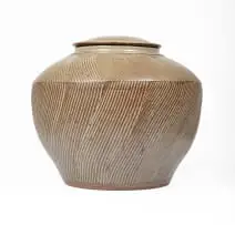 Digby Hoets, Green lidded jar, green wood ash glaze over combed slip