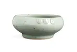 Hyme Rabinowitz, Flat bowl, porcelain with celadon glaze and stamp decoration