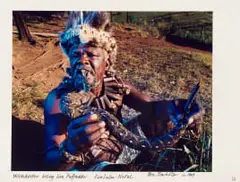 Obie Oberholzer, Witchdoctor Biting Live Puffadder. KwaZulu-Natal., 1994, hand-printed colour photograph