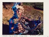 Obie Oberholzer, Witchdoctor Biting Live Puffadder. KwaZulu-Natal., 1994, hand-printed colour photograph