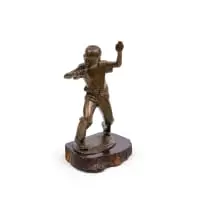 Penny Whistler by Jo Roos, bronze with a brown patina, on a wooden base, sold Sep 2025