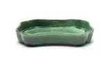 Globe Potteries, Rectangular dish with wavy rim, green-glazed earthenware