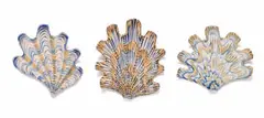 Lucie de Moyencourt, Three glazed ceramic shells with navy and beige motifs, hand-painted and glazed ceramic