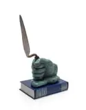 Jan K Coetzee, Workers of the World, 2024, carved wood covered by a mix of epoxy, copper and bronze filings; antique trowel; a copy of the book Werke/Das Kapital, by Karl Marx and Friedrich Engels, published in 1962.