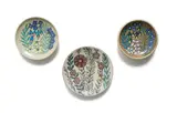Kalahari Studio, Small plates decorated with floral design, three, stoneware with overglaze decoration