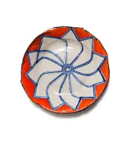 Plate in orange with blue linear flower by Ruan Hoffmann, 2004, painted and glazed ceramic, offered Nov 2025
