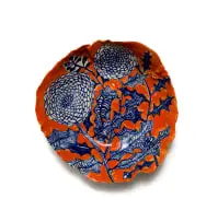 Bowl decorated with flowers in blue and orange by Ruan Hoffmann, 2011, painted and glazed ceramic, sold Nov 2025