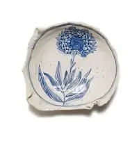 Bowl decorated with pincushion protea in blue by Ruan Hoffmann, 2007, painted and glazed ceramic, sold Nov 2025