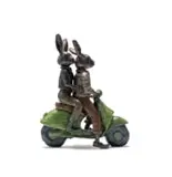 Carol Cauldwell, Rabbits on a Scooter, bronze with a brown and green patina
