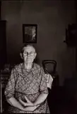 David Goldblatt, Ouma Hester Mostert, who came from Calitzdorp to Gamkaskloof as a 17-year-old bride, sitting at the door of her voorkamer. I asked if she would allow me to make a photograph of her. Would I send her a, silver gelatin print