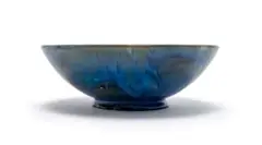 Bowl raised on low foot by Linn Ware, blue-glazed earthenware, sold May 2025