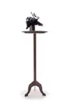 Rina Stutzer, The Collector, bronze with a black patina, granite and steel, on a steel base