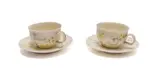 Katherine Glenday, Set of two cups and saucers with angel and banana motifs, two, painted and glazed porcelain
