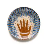 John Leask Nowers, Plate with a hand motif, painted and glazed ceramic