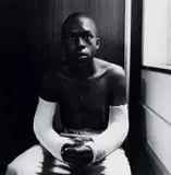David Goldblatt, Fifteen-year-old Lawrence Matjee after his assault and detention by the Security Police, Khotso House, De Villiers Street, hand-printed gelatin silver print