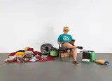 Duane Hanson, Flea Market Lady, 1990, polychromed bronze, textile, newspaper, found objects and metal folding chair