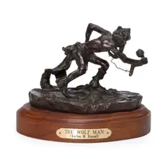 Wolf man by Charles Marion Russell, bronze with reddish brown patina on a wooden base, sold May 2012