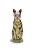 A yellow and black cat perched on a round base by Hylton Nel, painted and glazed ceramic, sold Sep 2024