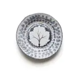Plate with a leaf motif in blue and white by Hylton Nel, painted and glazed ceramic, sold Sep 2024