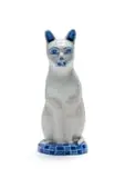 A blue and white cat perched on a checkered base by Hylton Nel, painted and glazed ceramic, sold Sep 2024