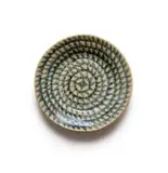 Plate with a spiral geometric motif by Hylton Nel, painted and glazed ceramic, sold Sep 2024