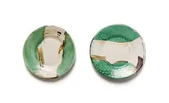 White and green plates with abstract brushstrokes, two by Clementina van der Walt, painted and glazed ceramic, sold Sep 2024