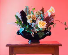 Sean Wilson, Foliage, Feathers, and Faux Flowers in Black Urn, photographic print
