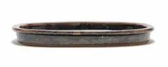 Rectangular dish by Esias Bosch, stoneware with granite glaze and iron decoration, sold Jul 2024