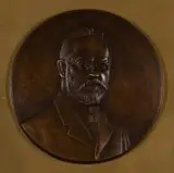 Anton van Wouw, Bas-relief Bust of Dr Herman Breijer, bronze with a brown patina