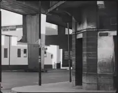 David Goldblatt, On the street corner of Pim and Goch Streets, under the M1, Newtown, December 1975, silver gelatin print on fibre-based archival paper
